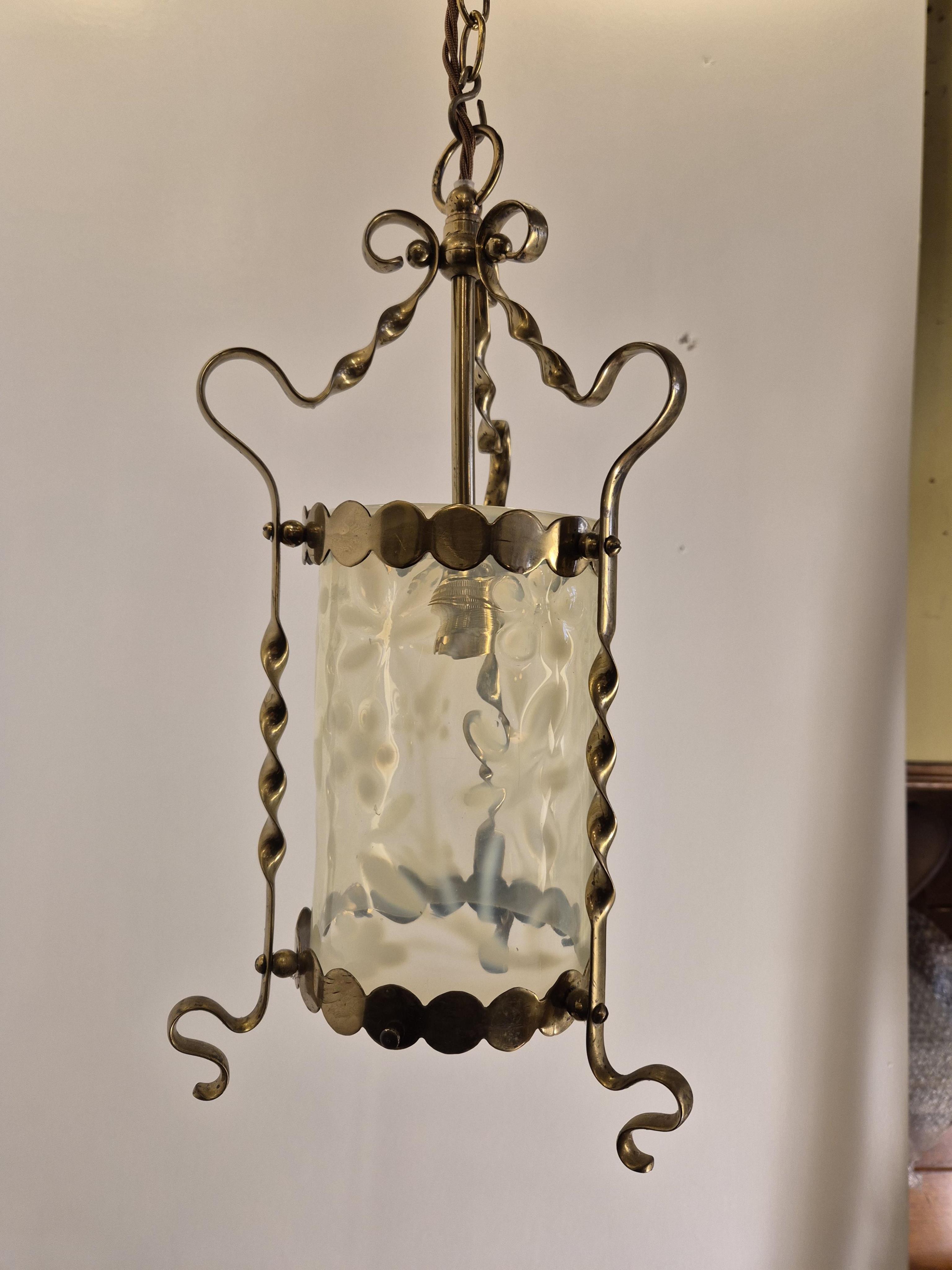 An English Arts and Crafts rise and fall pendant with Vaseline glass cylinder shade, circa 1900, wired, overall 55cm high, 34cm wide, glass 25cm high, 10.5cm diameter